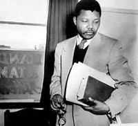 Nelson Mandela with books and eye glasses