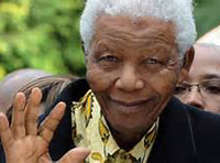 Older Nelson Mandela waving at crowd